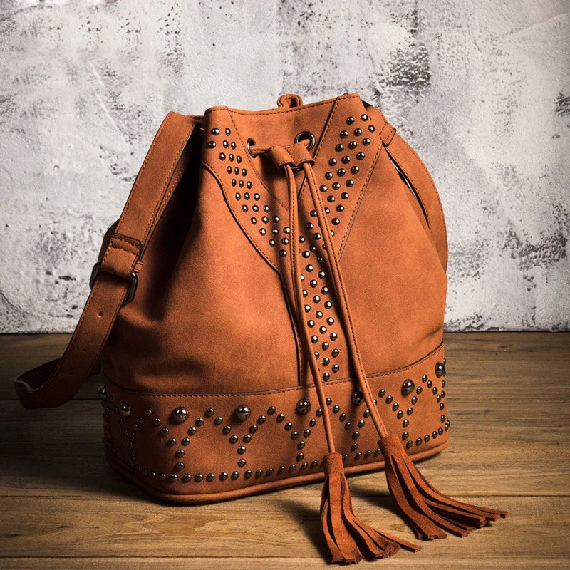 Waterproof crossbody bags for outdoor festival fun -Boho Womens Vegan Leather Crossbody Bucket Bag With Fringe and Rivets for Women