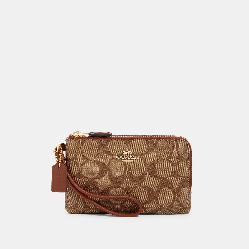 Handle bags with tie-dye patterns for fun -Coach Outlet Double Corner Zip Wristlet In Signature Canvas