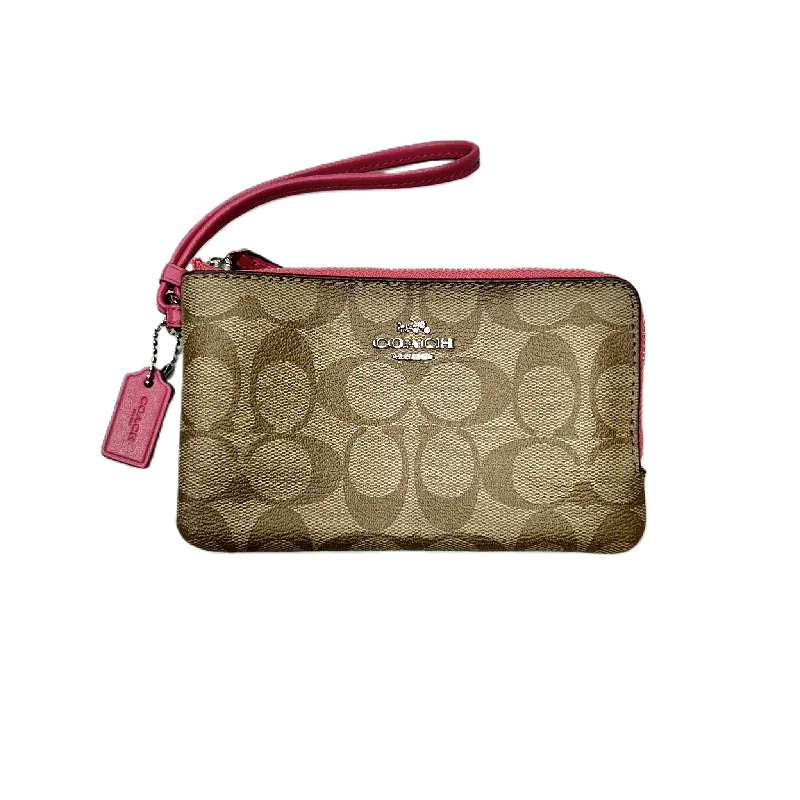 Reversible handle bags offering dual design styles -Wristlet Designer By Coach, Size: Medium