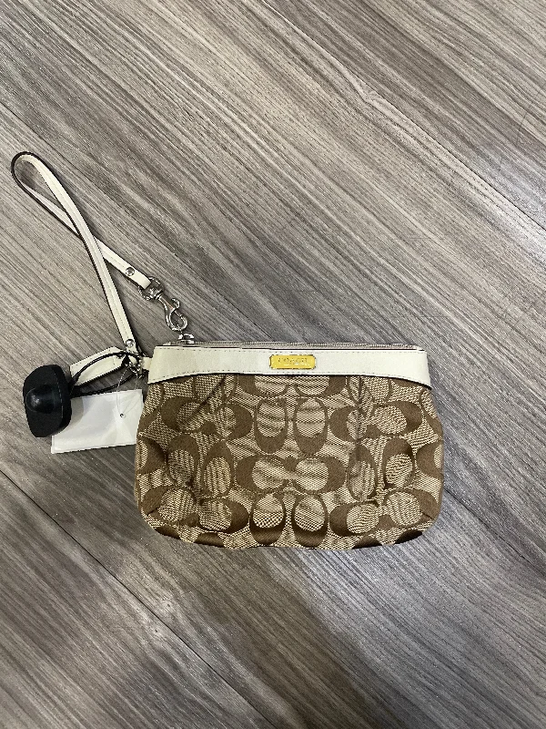 Reversible handle bags offering dual design styles -Wristlet Designer By Coach, Size: Medium